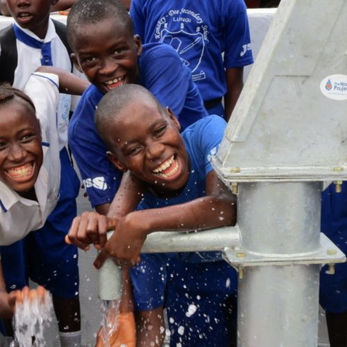 Children enjoying a newly installed water source