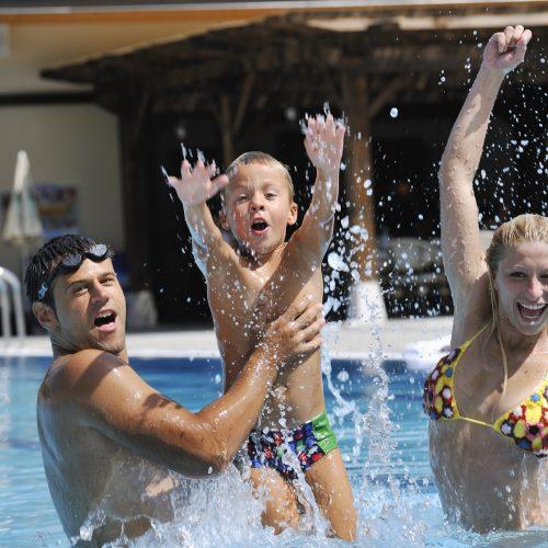 Family having fun in a swimming pool