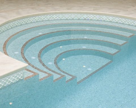 Luxury mosaic stairs leading into pool