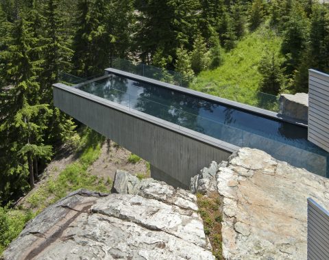 Infinity pool suspending over the side of the rock