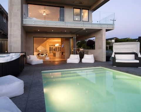 Infinity pool looking back into the outdoor living space