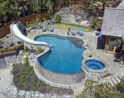 Arial view of water slide leasing into the main swimming pool