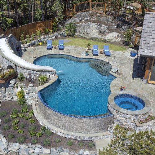 Arial view of water slide leasing into the main swimming pool