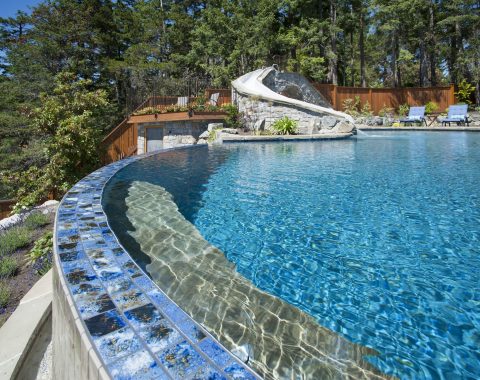 Different colored mosaics were used to create a boarder for the pool