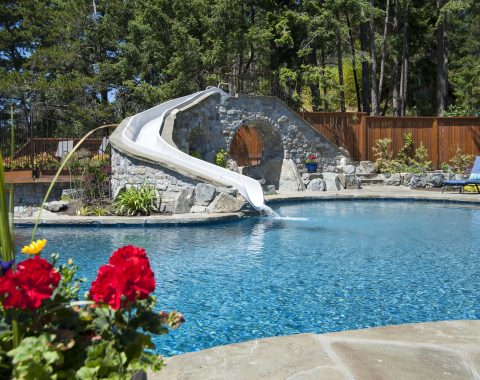 View of the tranquil pool and large water slide