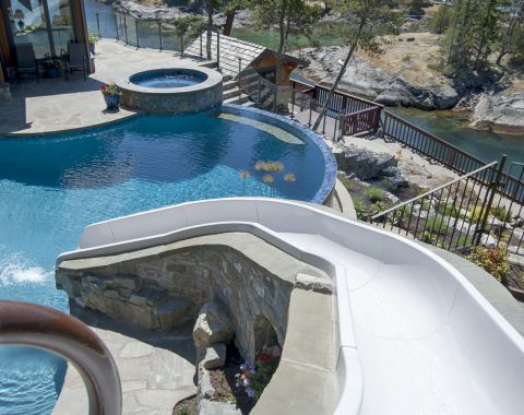 View from sliding down the custom slide into the pool