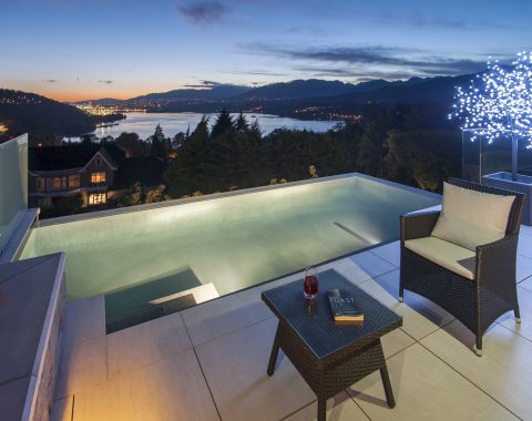 Infinity pool in the night showcasing pool lighting