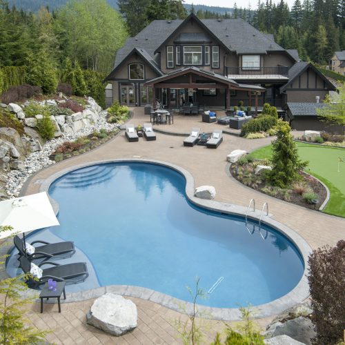 Freeform swimming pool blended into nature