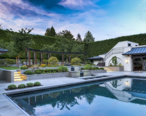 The outdoor swimming pool features a custom blend of onyx colored pool plaster that creates a rich teal hue by day and turns a smoky blue at night when lit with the beautiful white LED lights.