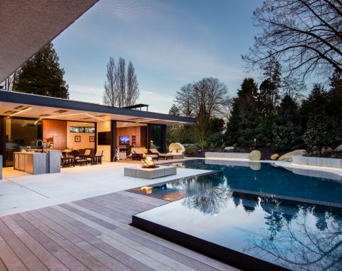 Experience modern elegance in this outdoor oasis, where sleek ironwood and cool concrete pavers combine to create a striking deck.