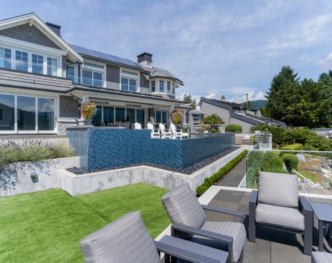 View of the infinity edge pool water fall from lower patio