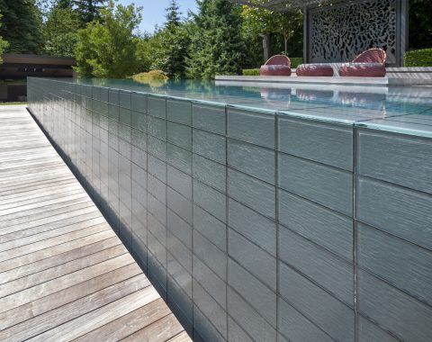 Light colored tile with water falling over the side