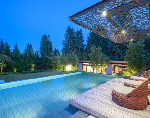 Large pool with wooden outdoor living area