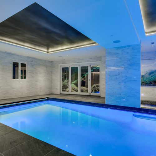 Modern indoor swimming pool with color lighting