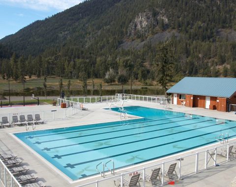 Commercial pool contractors have created a large lane pool in the middle of the mountains