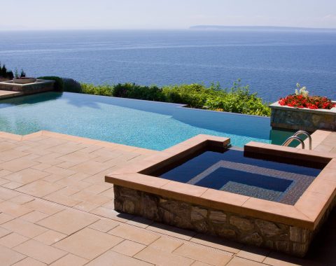 Square shaped hot tub and spa built away from the main swimming pool