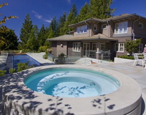 Stand alone concrete hot tub and spa with large seating area