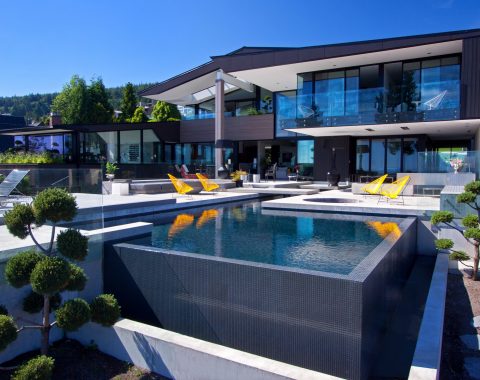 Infinity pool with water feature style edging