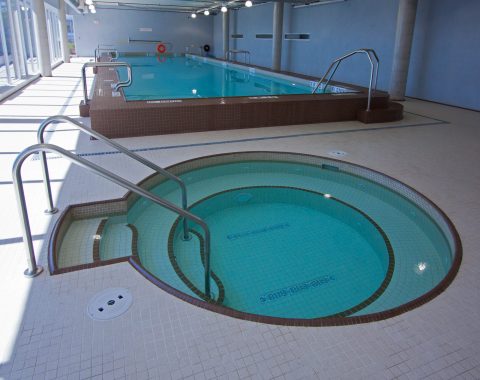 Commercial pool contractors have created an indoor pool and spa