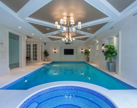 Indoor swimming pool builders created a pool with classic design and built in spa