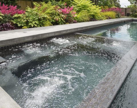 Flood edge style hot tub and spa built into the main swimming pool