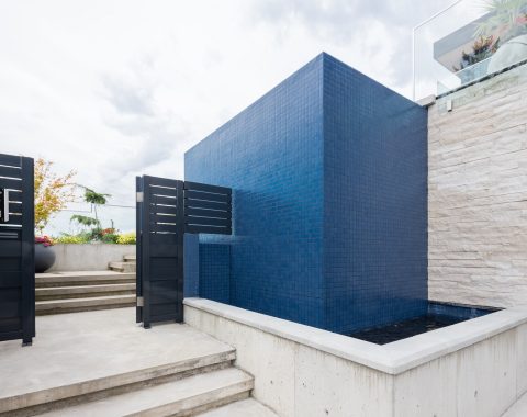 Grand view of waterwall feature in versatile swimspace.