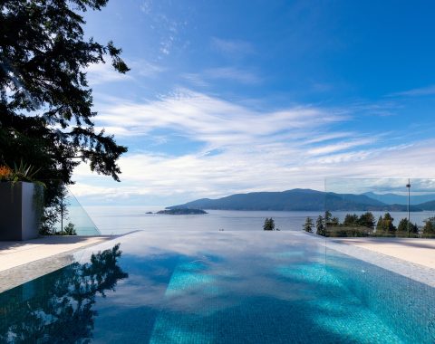 A perfect color match from the infinity pool to the nearby inlet creates the impression that the pool extends the horizon.