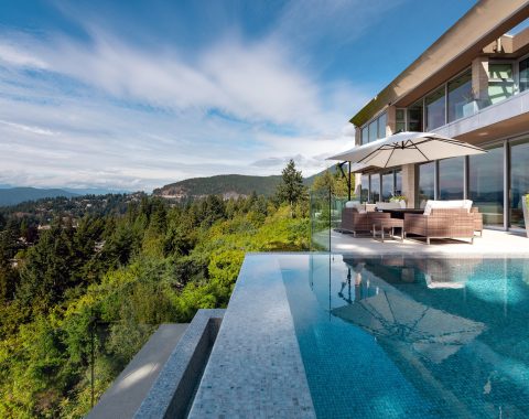 Side view of an infinity pool with a rich blue color palette.