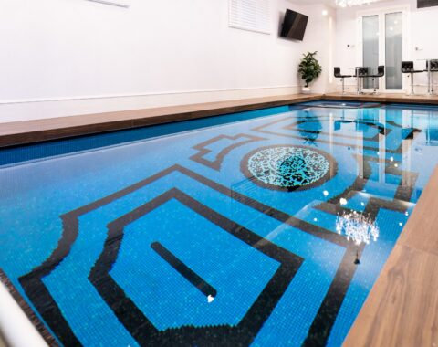 Swimming pool with custom tile design - a sanctuary in your own home.