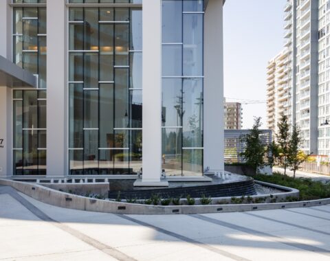 Transform your commercial space with a stylish curved water feature and modern design elements.