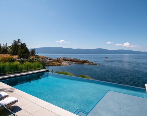 Beachfront property with breathtaking ocean views over the stunning infinity edge pool. A Baja shelf complete with umbrella stand is the perfect spot for lounging and relaxing.