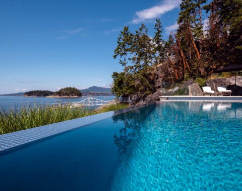 Beachfront property with stunning ocean and mountain views from the infinity pool.