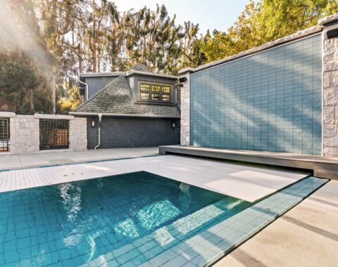 Beautiful pool with a waterfall feature and crystal clear water, perfect getaway.