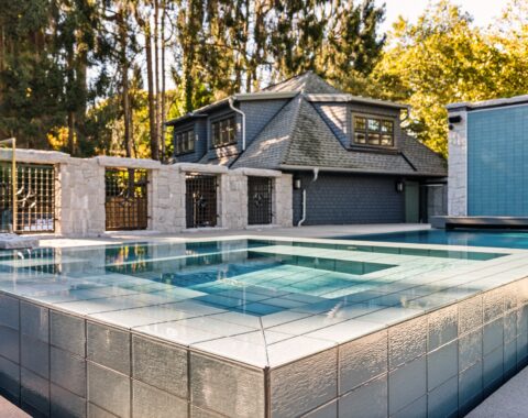Beautiful hot tub and pool with natural landscape and crystal clear water.
