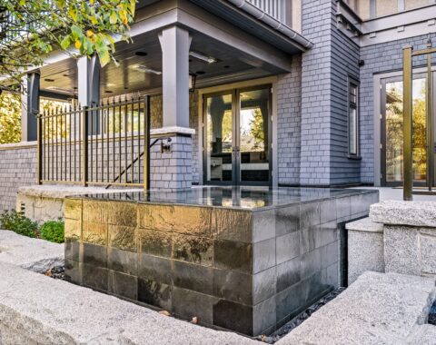 Beautiful waterfall feature with natural landscape and crystal clear water.