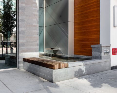 Relaxing waterfall sounds heard from a peaceful bench area for a calming experience.