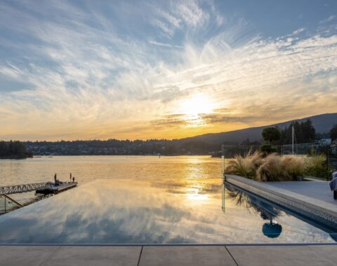 Pool reflecting the endless horizon view at sunset.